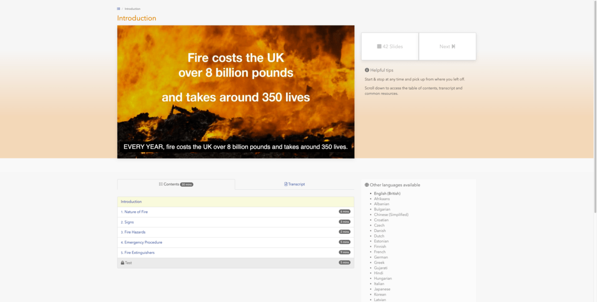 The image shows an online course interface with the title "Introduction" at the top. The main section displays a slide with a background of intense flames and the text, "Fire costs the UK over 8 billion pounds and takes around 350 lives." Below, in a black bar, it repeats, "EVERY YEAR, fire costs the UK over 8 billion pounds and takes around 350 lives." To the right of the slide are buttons labeled "42 Slides" and "Next." The sidebar on the right includes "Helpful tips" and a section titled "Other languages available," listing multiple languages including English (British), Afrikaans, Albanian, and many more. Below the slide, there's a "Contents" section indicating a 30-minute total course duration with topics like "Nature of Fire," "Signs," "Fire Hazards," "Emergency Procedure," and "Fire Extinguishers," each with respective time estimates. A "Test" section is also listed at the bottom of the contents.